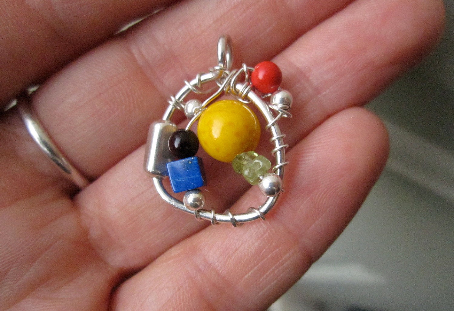 Colorful Cheerful Art Pendant- Sterling Silver, Acai Seed, Peridot, Coral, Howlite, Tigerseye.