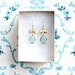 Golden Bow And Aqua Glass Charm Dangle Earrings
