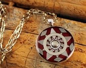 dark red metal star necklace in silver