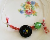 Sweet Addie. vintage glass flower button,string bracelet. Tiedupmemories