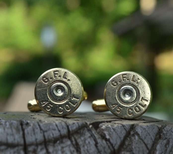 Bullet cufflinks fashioned from repurposed gold/brass Fiocchi .45 Long Colt shell casings