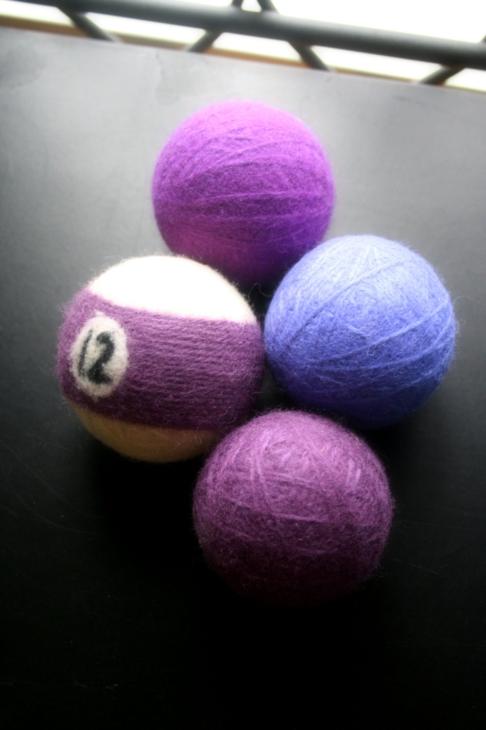 Wool felted dryer balls ... set of 4... Purples with one billiard ball ... Ready to ship
