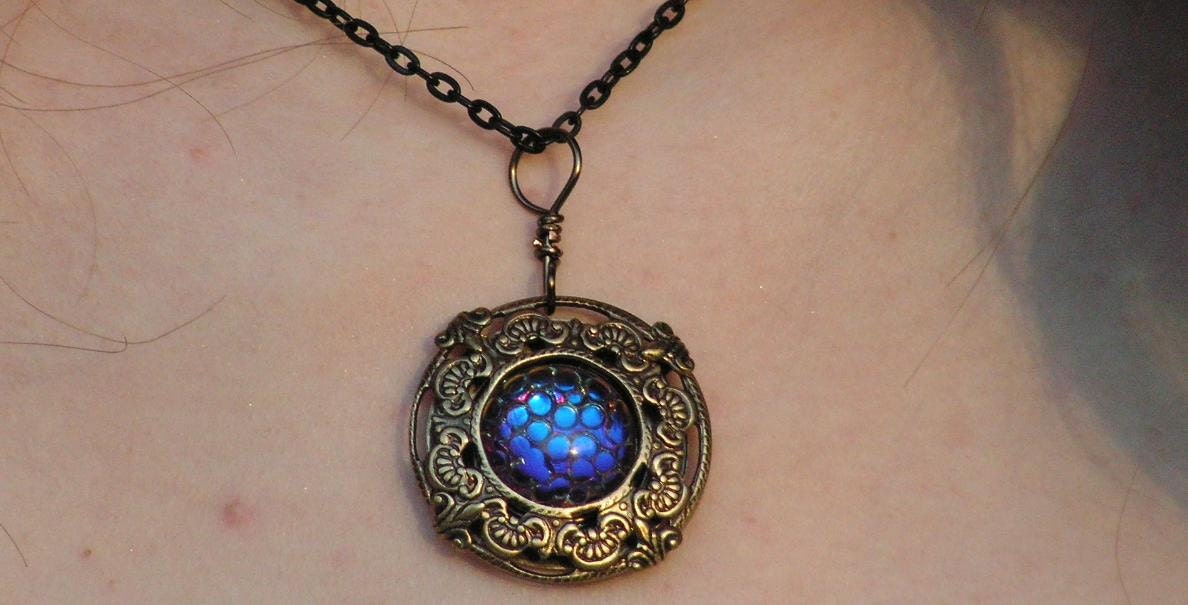 Dragon's Skin Necklace in antiqued gold filigree flashes of Sapphire and Fuschia Free Ship in US