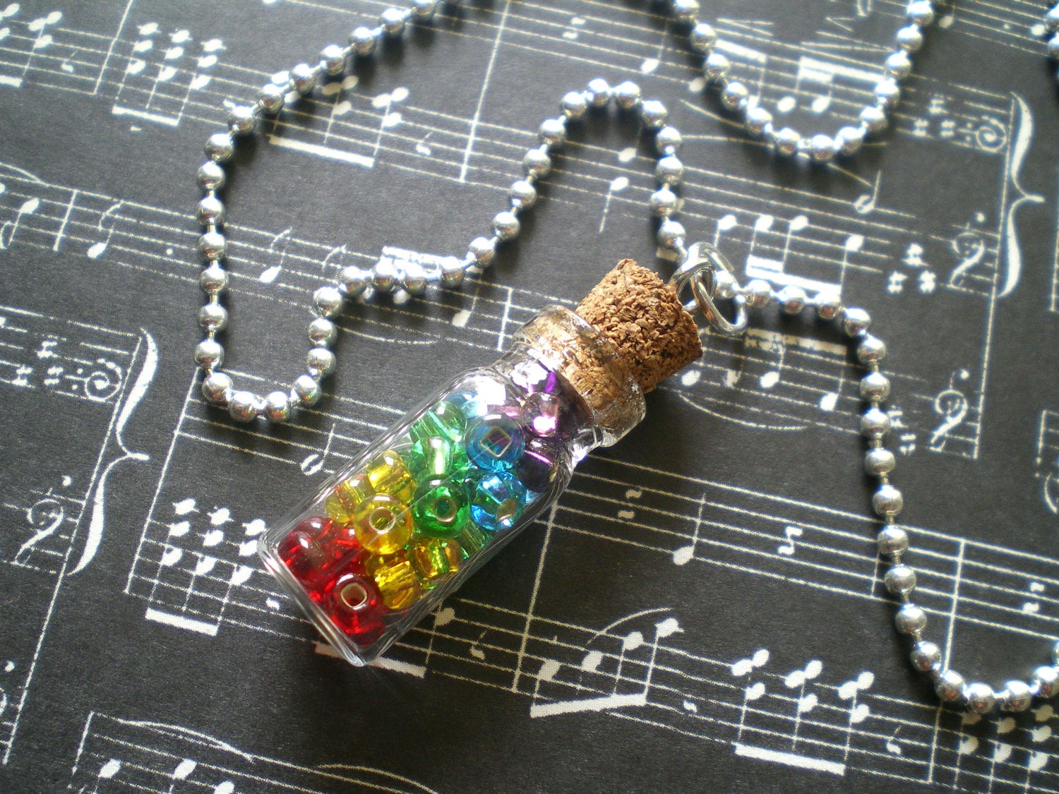 after the rain, comes the rainbow - colorful, bead-filled glass bottle necklace