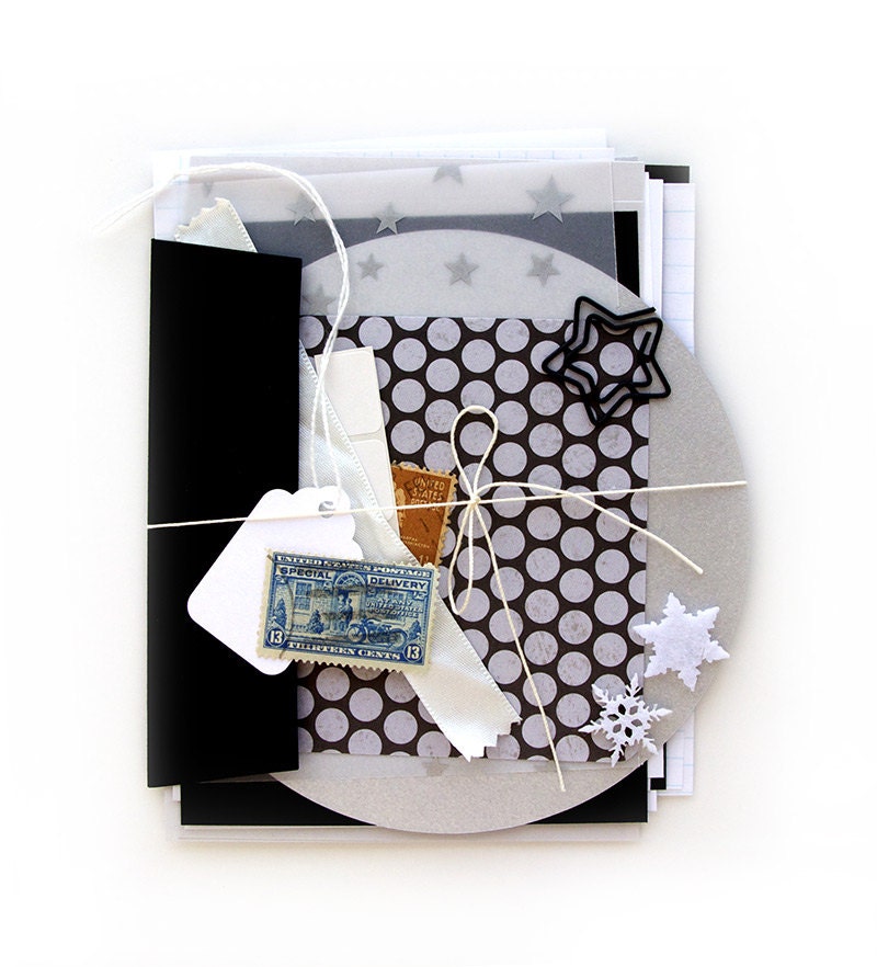 Silver Scrapbooking Kit with embellishment, black, white, and gray paper and vintage stamps