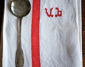 French antique silver spoon and monogrammed linen metis