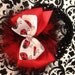 Red, white, and black ladybug hair bow