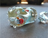 Handmade Glass Skull Bead with clown and matching nuggets