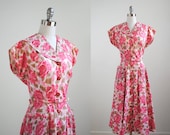 vintage 50's pink full dress. 1950s floral dress. white. flower print. large. belt. buttons. hot pink dress 50.