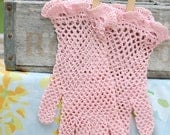 Pink crocheted gloves