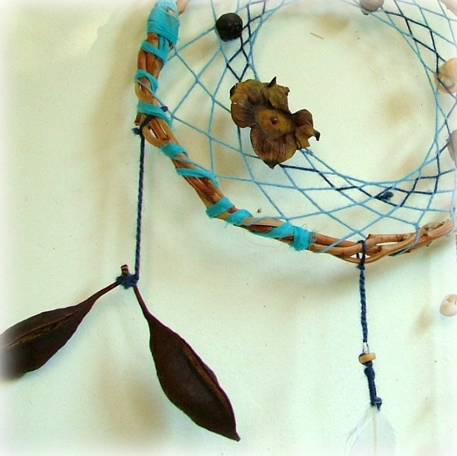 Baby mobile earth art magical dream catcher weaved in 2 shades of blue with black pods, white feather and many natural surprises. - MammaEarthCreations
