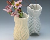 Hand carved pale yellow porcelain curvy vase