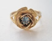 SALE 10 PERCENT OFF Vintage 80s Traditional Cottage Chic Gold Tone Prong Set Light Topaz Blue Rhinestone Rose Flower Adjustable Ring