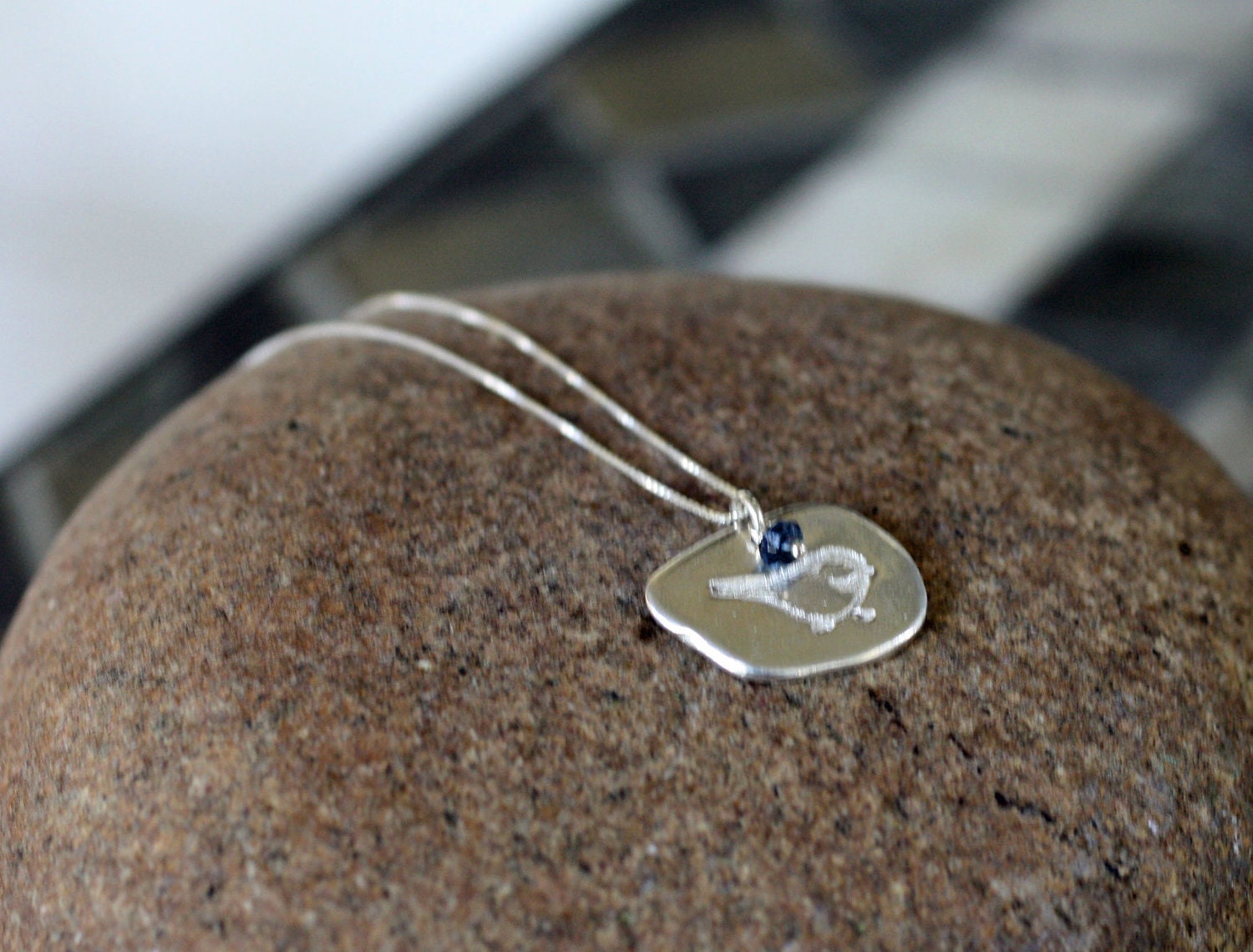 Fine silver bird and London blue topaz charm necklace