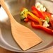 Wooden kitchen utensil spatula for flipping and stirring of Sugar Maple