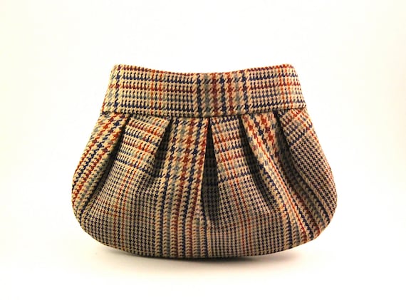 If Sherlock Holmes Carried a Clutch Purse...