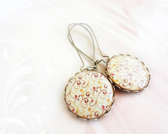 Red orange swirls earrings in antique brass