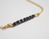 Black jet bracelet. Gold metal chain. Beaded bracelet.