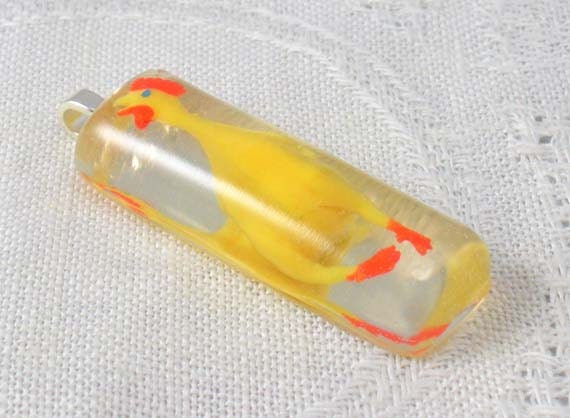 Pendant: Mini rubber chicken cast in resin, just for fun
