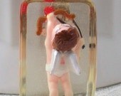 Pendant: Mini plastic cupid cast in resin, just for fun