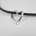 Leather short necklace with sterling silver heart pendant.