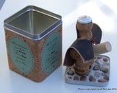 MATURE-Cork Figurine--Cork Man: The Caped Connoisseur (tm) Deluxe Version with Cork Wrapped Tin Case/Stand and Pebble Mosaic Lid