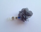Gray flower badge holder