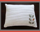 Grey and Red Fabric Leaves on Quilted White Pillow