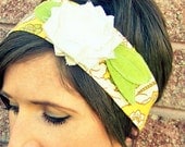 Lillie Wraps - gold and green floral print headwrap with lime green leaves and a white ruffled jersey flower
