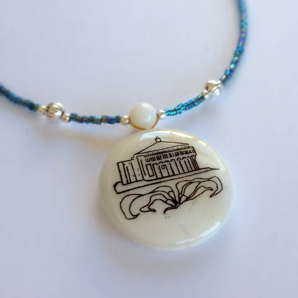 Catalina Island Drawing On Shell Pendant Strung With Blue Irridescent Glass and Silver Beads