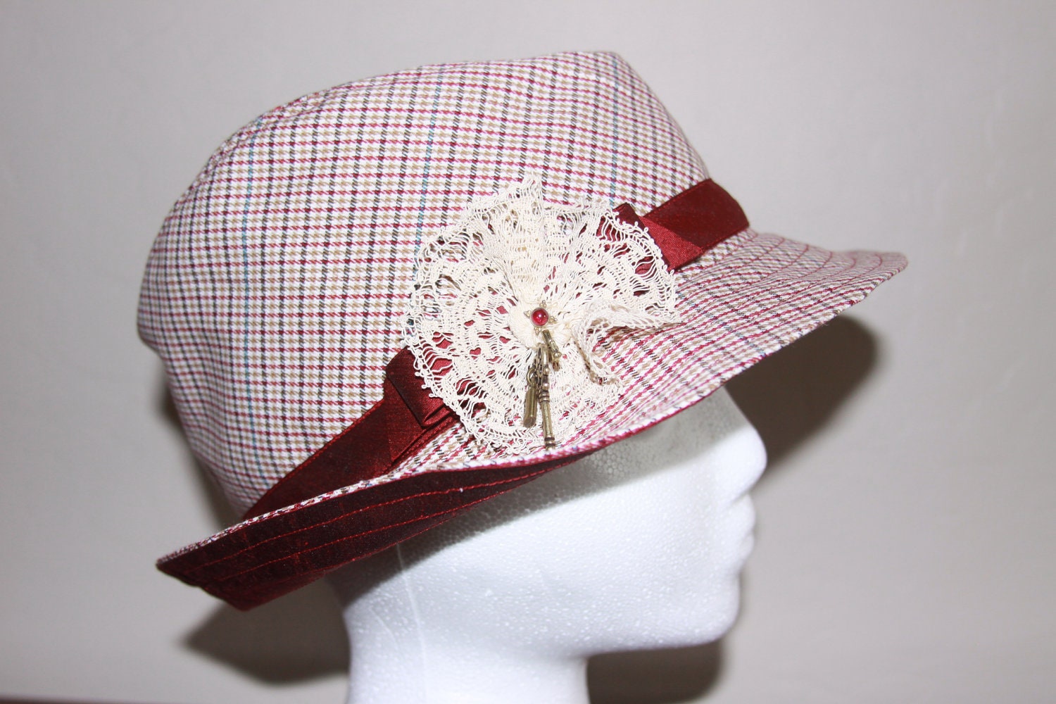 Houndstooth-like lightweight wool fedora with silk lining and band. Side antique lace medallion with garnet earring and key charms - APPLIQUEtoZIPPERS Houndstooth-like lightweight wool fedora with silk lining and band. Side antique lace medallion with garnet earring and key charms - APPLIQUEtoZIPPERS