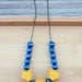 NECKLACE Geometric Wood Beads in Navy and Yellow strung on Antique Brass Ball Chain