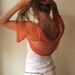 light orange short sleeved shrug