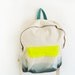 forest green backpack with neon yellow pouch