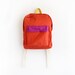 orange backpack with magenta pouch