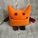 Wibbly Woo - a stuffed plush pocket monster in orange