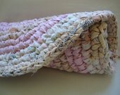 vintage braided rug in muted pastels
