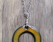 The Positivity Circle Reversible Necklace Orange and Blue Copper Enamel on a sterling silver chain Emanate Transform Surround