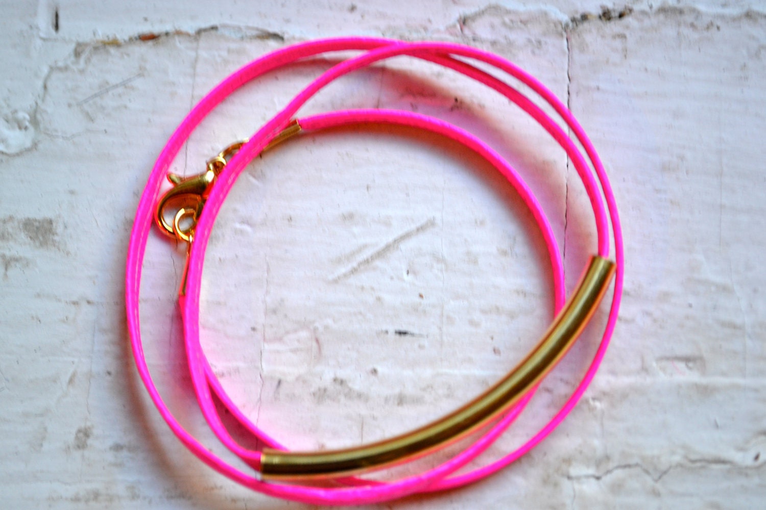 neon pink skinny leather triple wrap bracelet with long gold tube