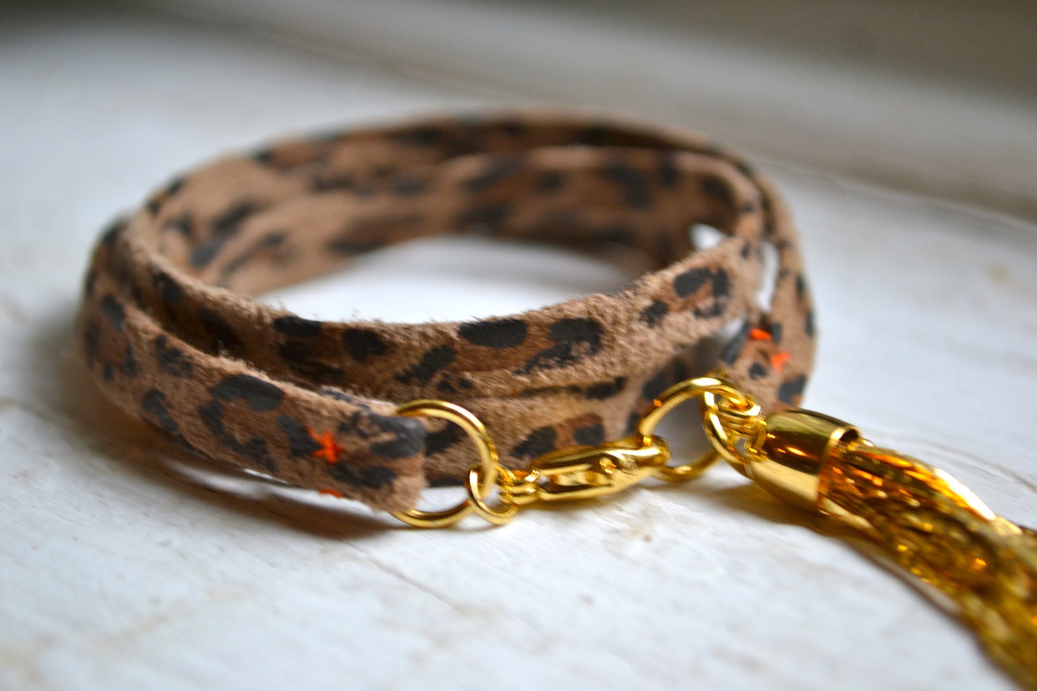 brown and black leopard suede genuine leather triple wrap bracelet with gold tassel