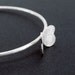 Delicate Oxidized-Texturized Sterling Silver Bangle. Roll Printed. White. Round Shaped. VARIACIONES II Bangle. Handmade by Maria Goti Joyas.