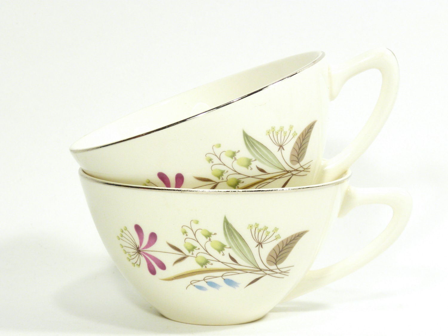 vintage teacups . drink coffee or tea out of these beauties . floral pattern . great atomic handle . large size - not dainty