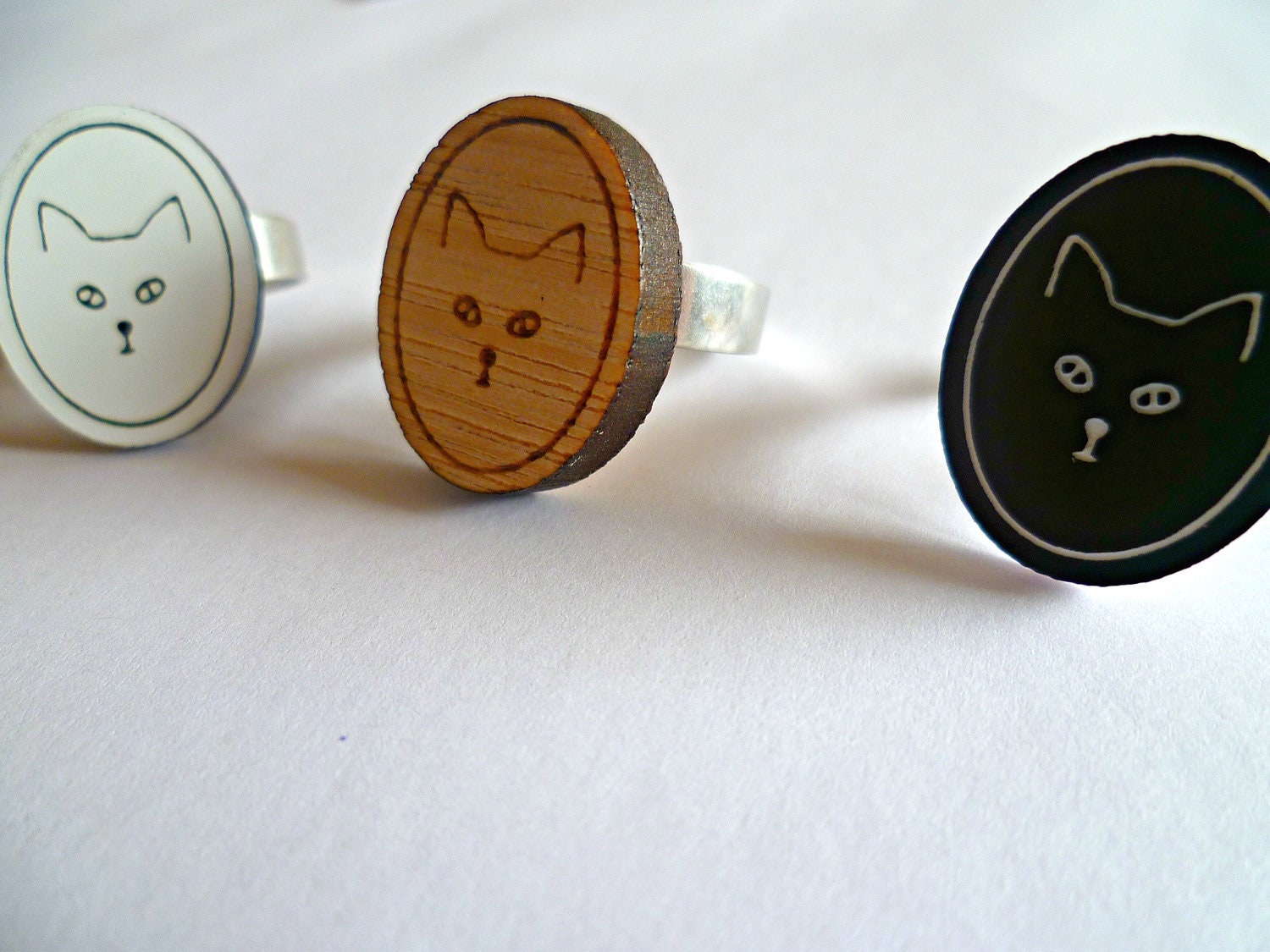 Asta's Cat- ring in Tasmanian Oak wood or black or white acrylic