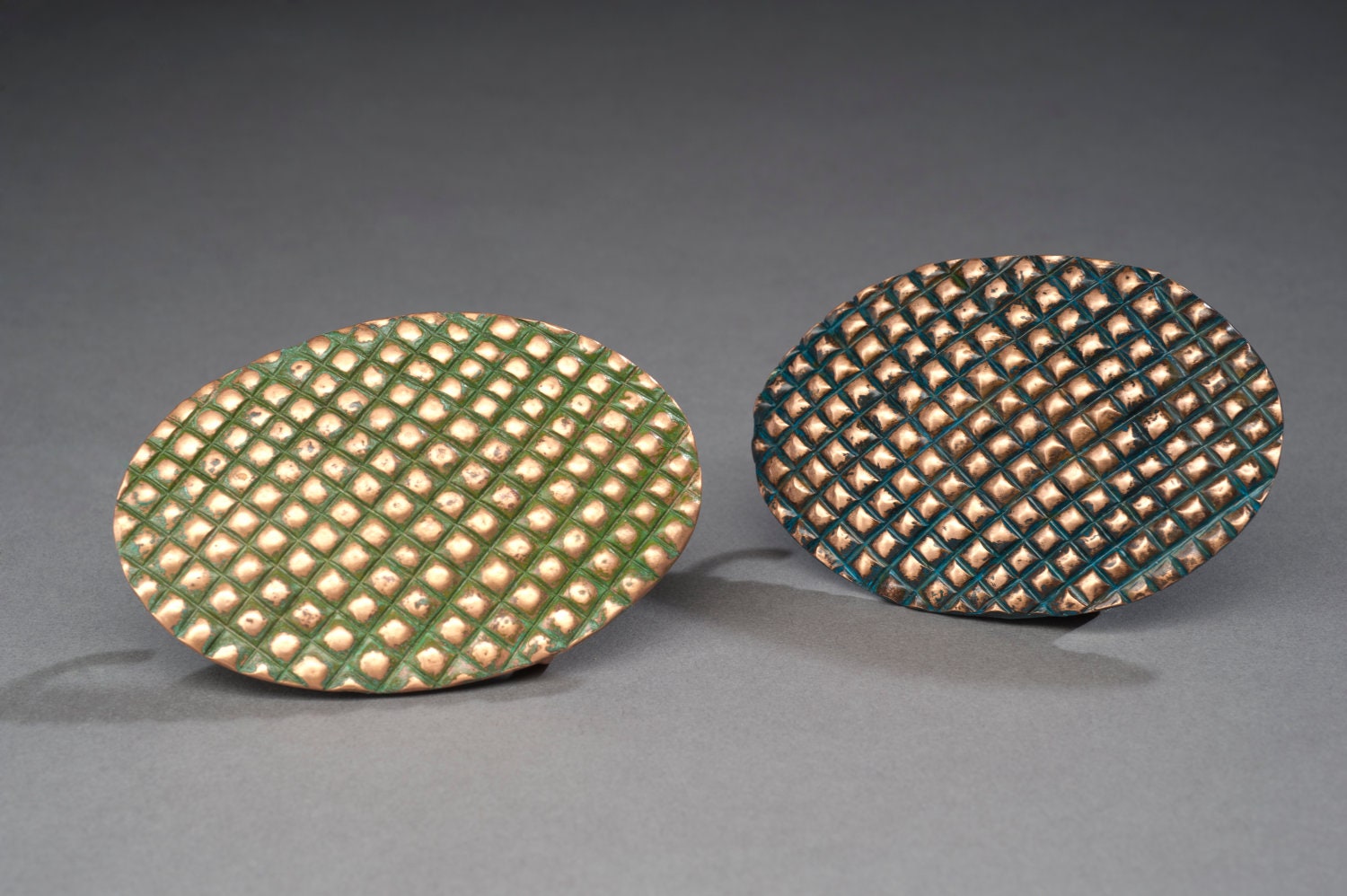 Chasing repousse copper Grid themed belt buckles blue and green patinas