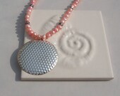 Coral Colored Fresh Water Pearls with a Stainless Steel Pendant