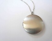 Silver locket necklace on long silver necklace chain. Matte silver medium locket.