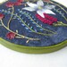 Wild Garden - Hand Embroidered Floral Wall Hanging in Blues, Pinks and Plums
