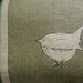 Hand printed and stitched little olive loomstate linen jenny wren cushion