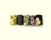 Hand rolled fiber beads in harvest time printed cotton