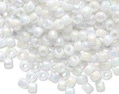 Size 6/0 opaque white rainbow Matsuno glass seed beads, 20 grams (approx. 340 beads)